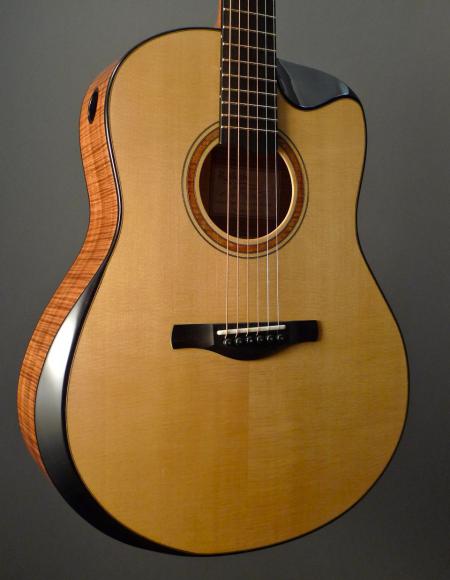 Tasmanian blackwood / Lutz spruce jumbo acoustic guitar with beveled armrest, soundport, and scoop cutaway